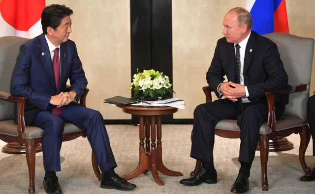 Синдзо Абэ и Владимир Путин 