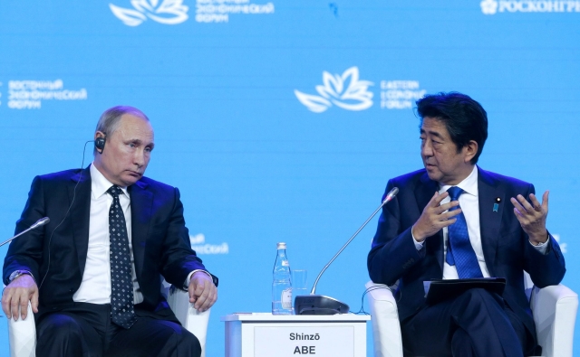 Владимир Путин и Синдзо Абэ 
