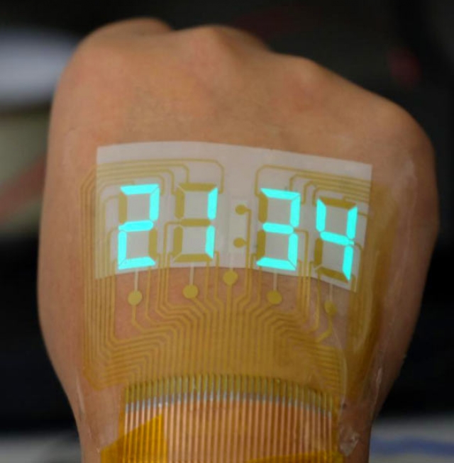 Китайские учёные поместили гибкий светящийся таймер на кожу человека
